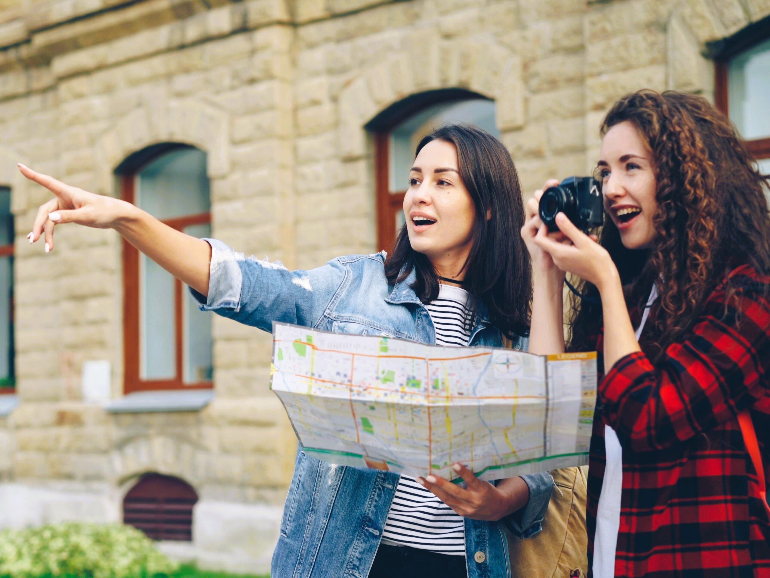 Person planning international travel itinerary on world map for visa and holiday trip